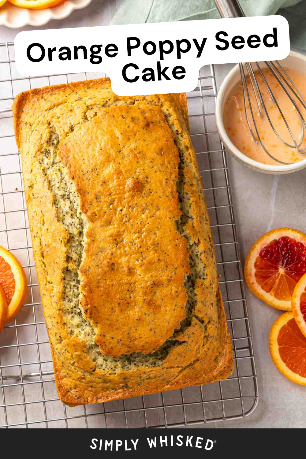 A loaf of orange poppy seed cake sits on a cooling rack, surrounded by fresh orange slices and a bowl of glaze with a whisk. Text reads Orange Poppy Seed Cake, highlighting the vibrant flavors in every slice.