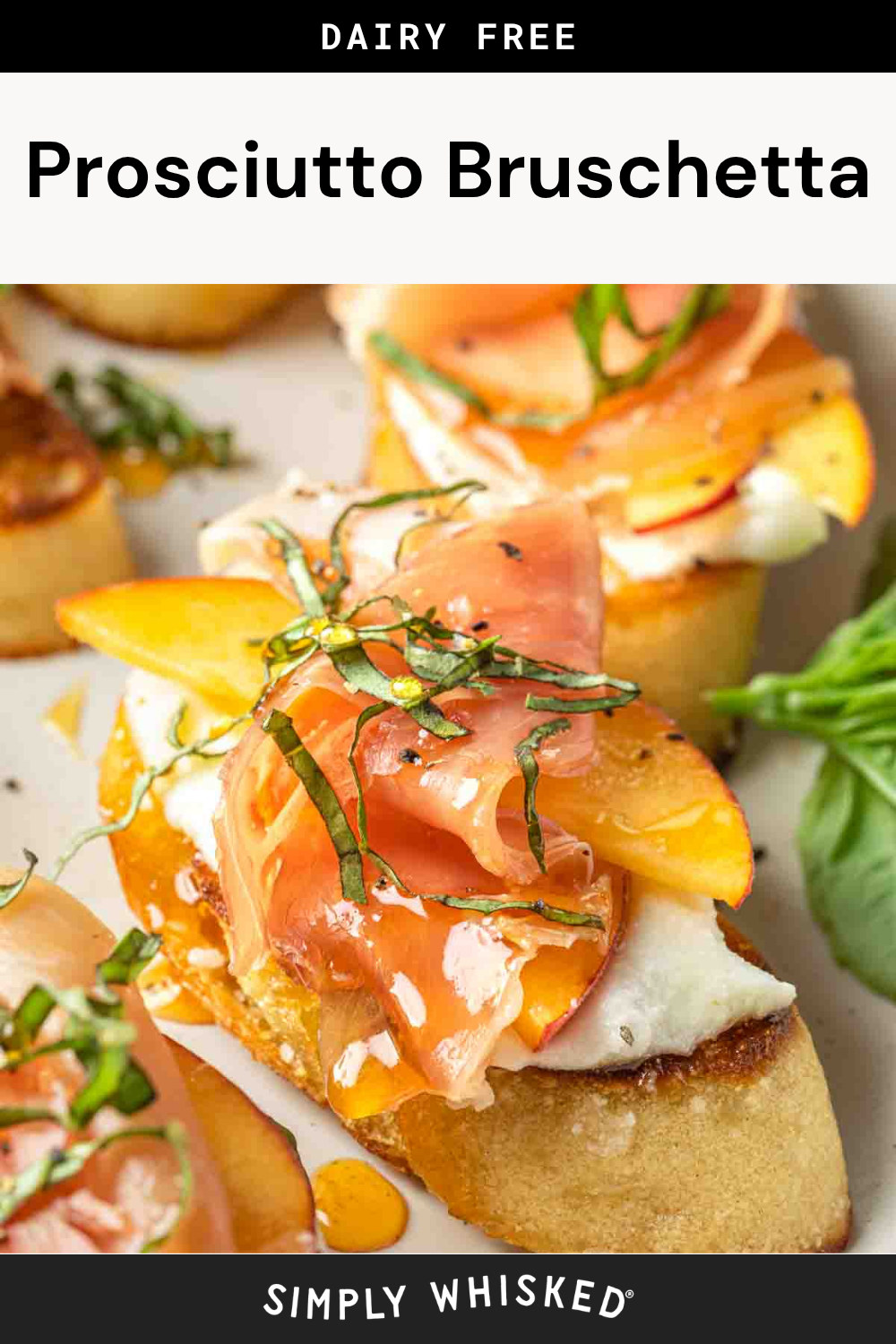Close-up of Prosciutto Bruschetta topped with peaches, herbs, and a creamy dairy-free spread on toasted bread, with a fresh basil leaf on the side. Text above and below the image labels the dish as Prosciutto Bruschetta.