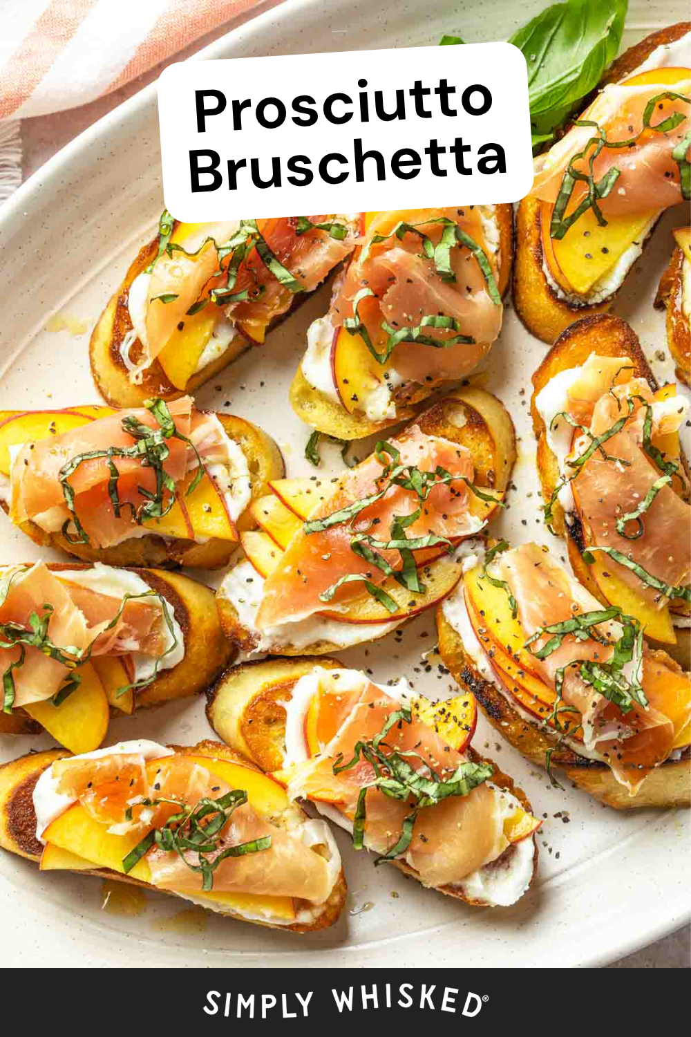 A platter of Prosciutto Bruschetta topped with sliced peaches, creamy cheese, and fresh basil, all artfully arranged on toasted bread slices.