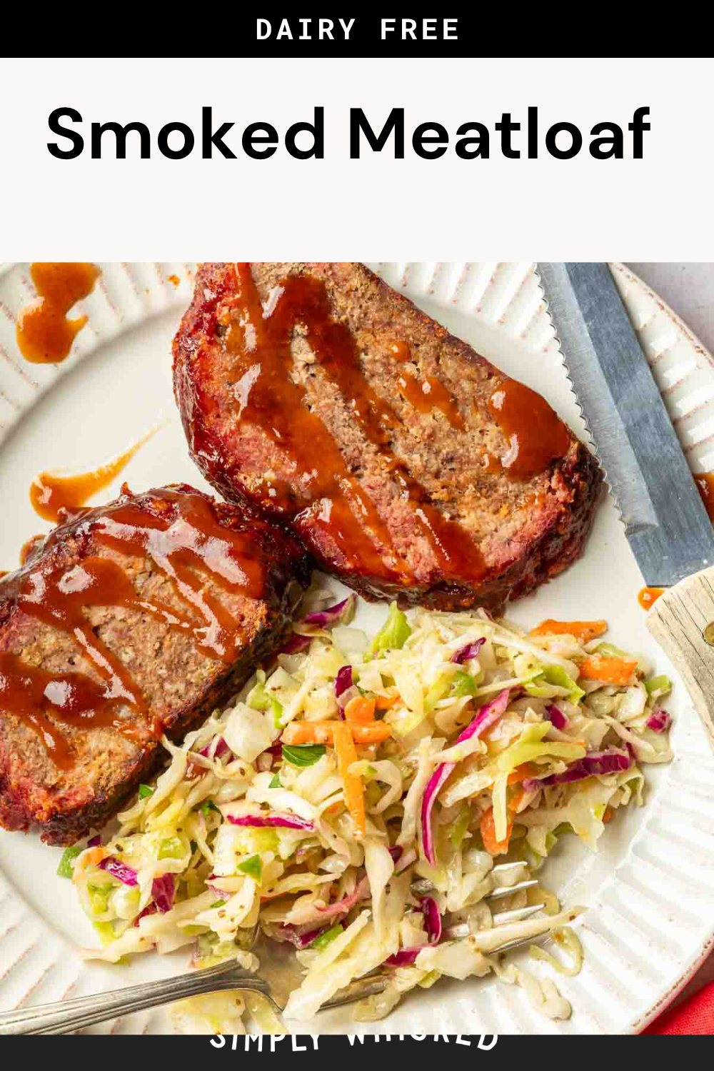 A plate features two slices of Smoked Meatloaf drizzled with sauce, served with vibrant coleslaw. A fork and knife rest nearby. Text above reads “Dairy Free Smoked Meatloaf.”.