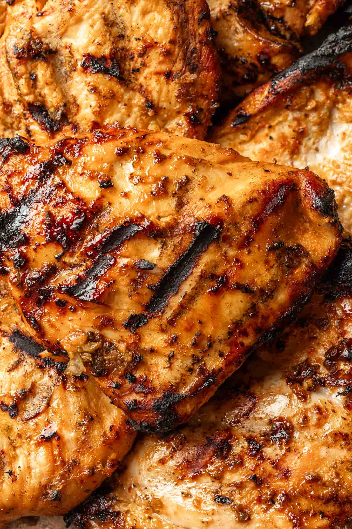 Close up of grilled chicken thighs. 