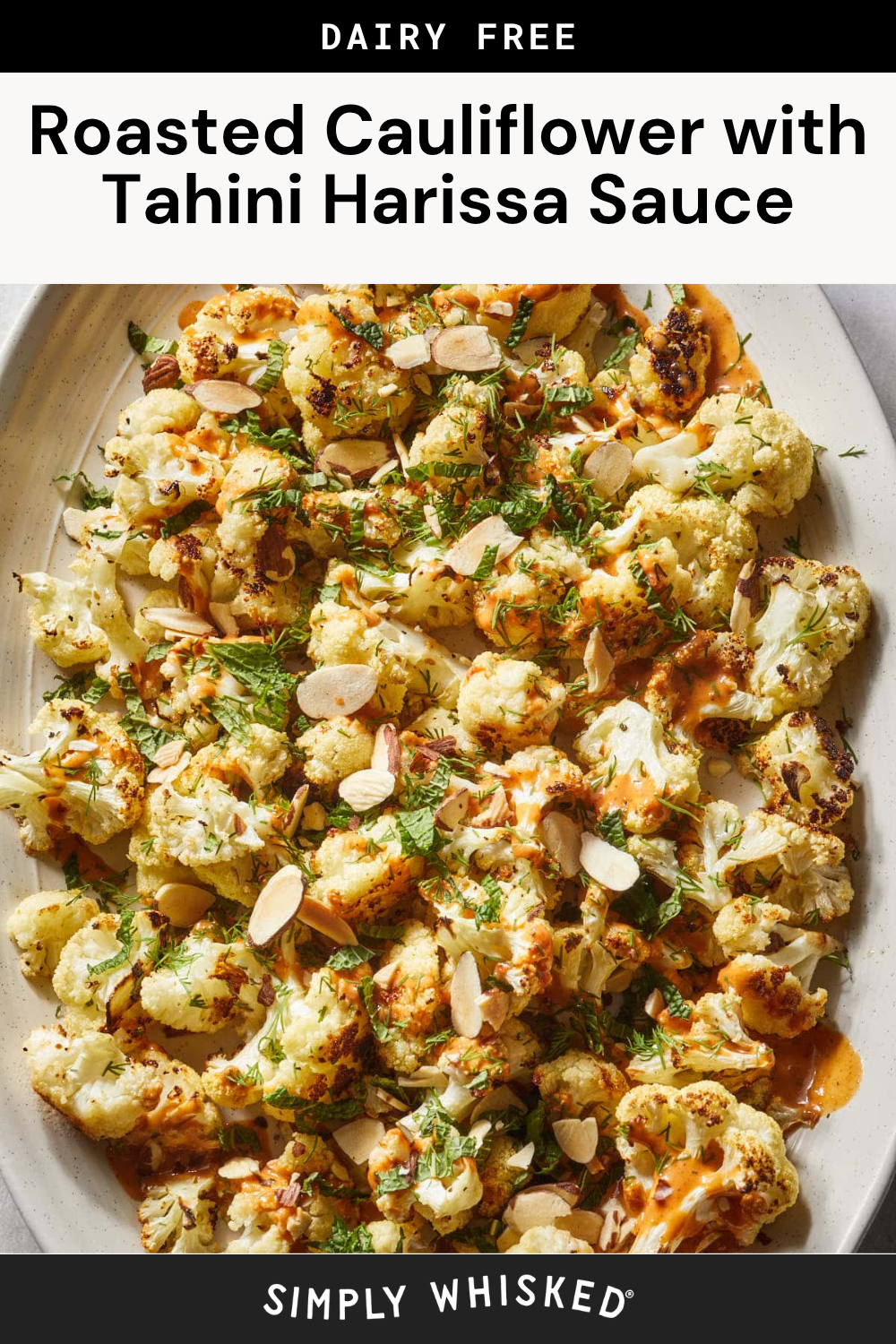 A platter of Harissa Roasted Cauliflower topped with sliced almonds, fresh herbs, and drizzled with creamy tahini harissa sauce, labeled as dairy free.