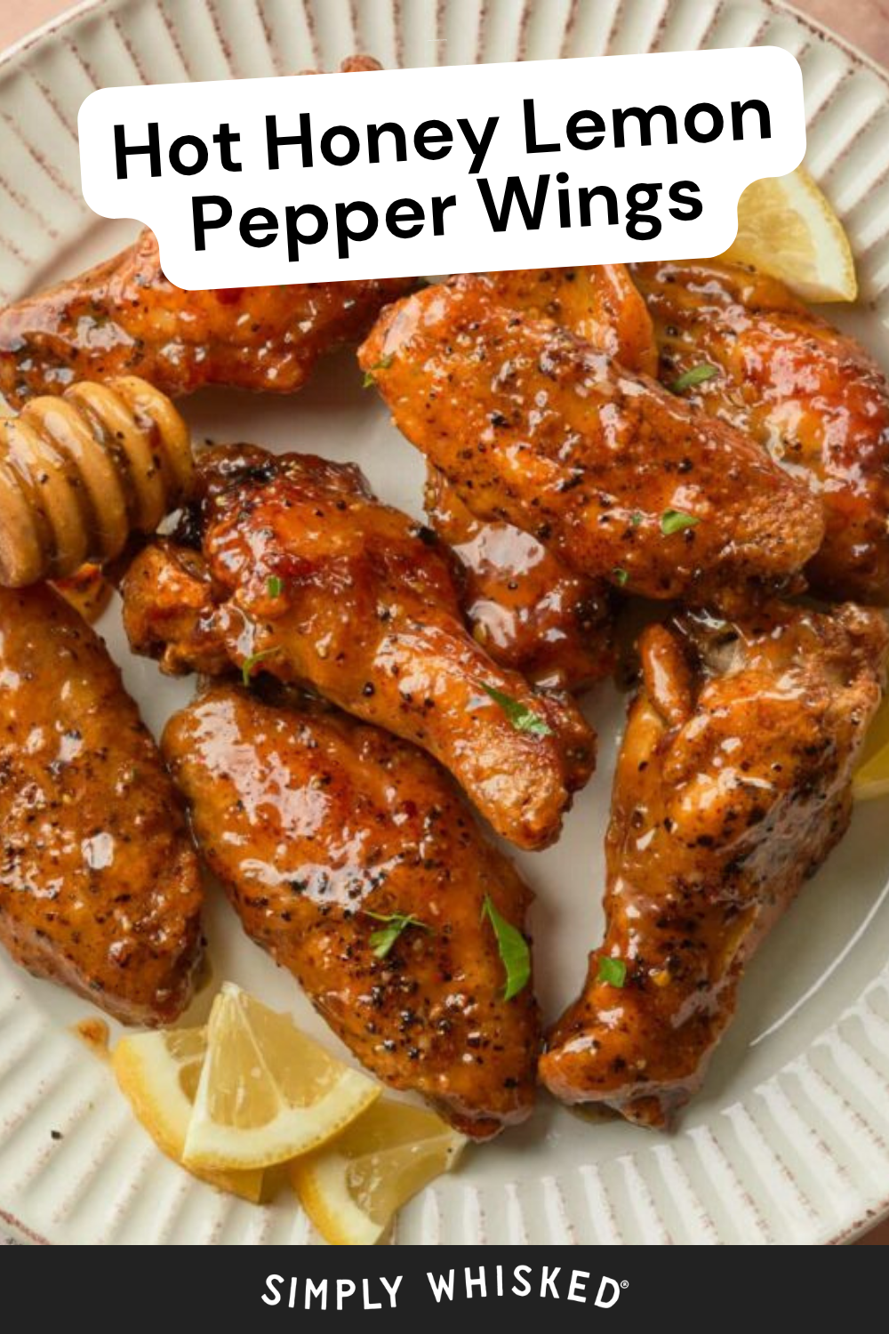A plate of Honey Lemon Pepper Wings glazed to perfection, garnished with cracked pepper, fresh herbs, and lemon wedges. A honey dipper rests beside the wings. Text reads Hot Honey Lemon Pepper Wings at the top and Simply Whisked at the bottom.