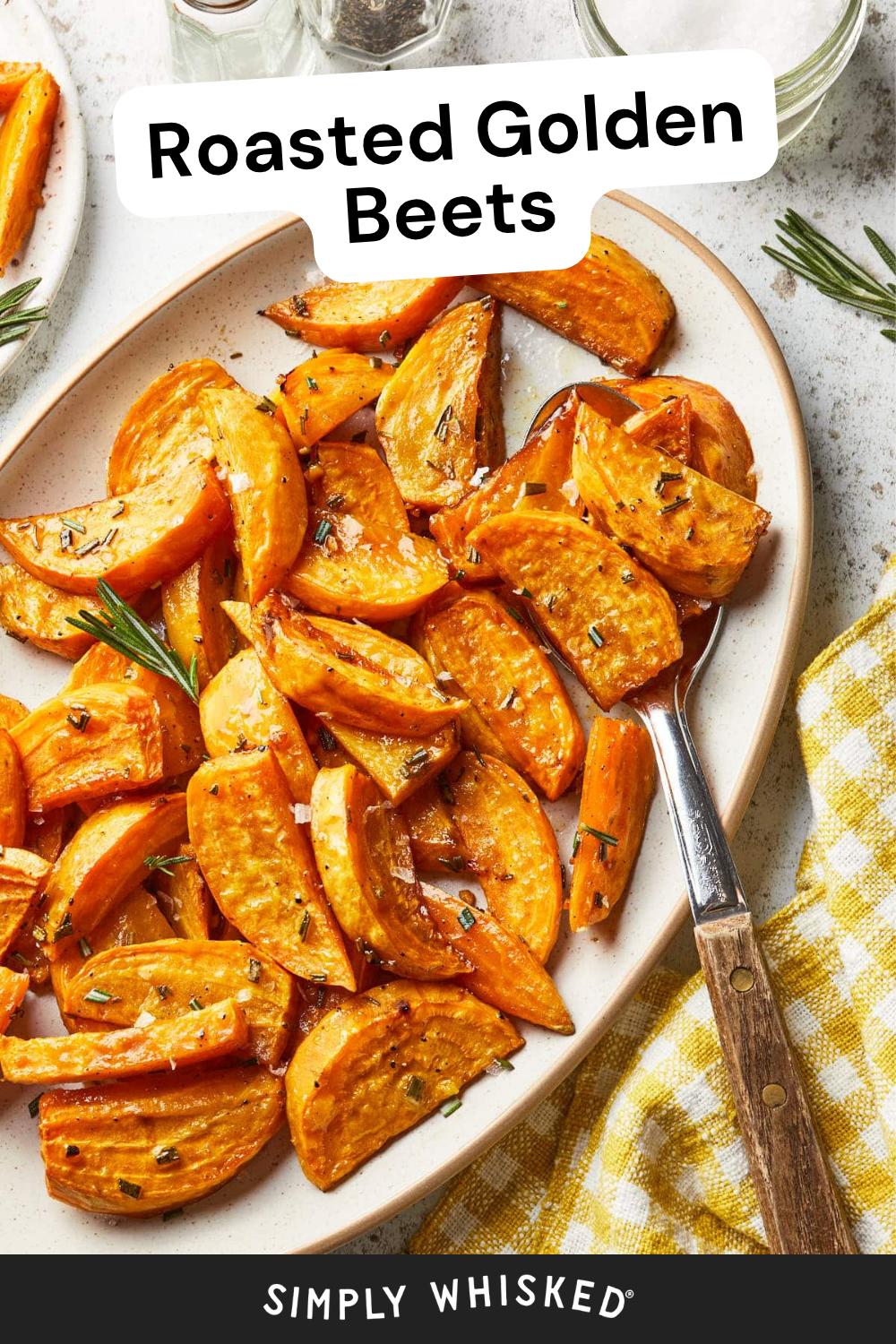 A plate of sliced roasted golden beets garnished with herbs, served with a fork on the side. A yellow checkered napkin and rosemary sprigs are nearby, enhancing the natural beauty of the Roasted Golden Beets. Text reads Roasted Golden Beets and Simply Whisked.
