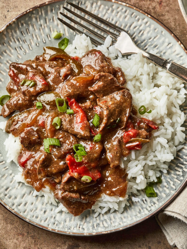 Pepper steak served over a bed of white jasmine rice.