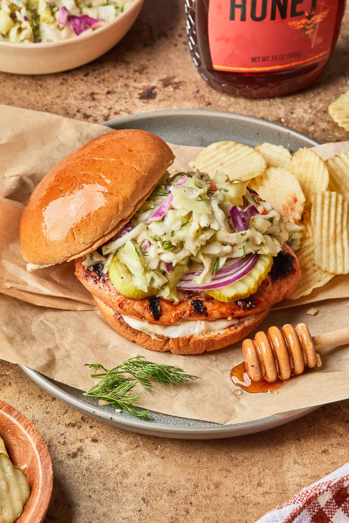 A hot sandwich, open faced showing the pickle slaw topping the sandwich.