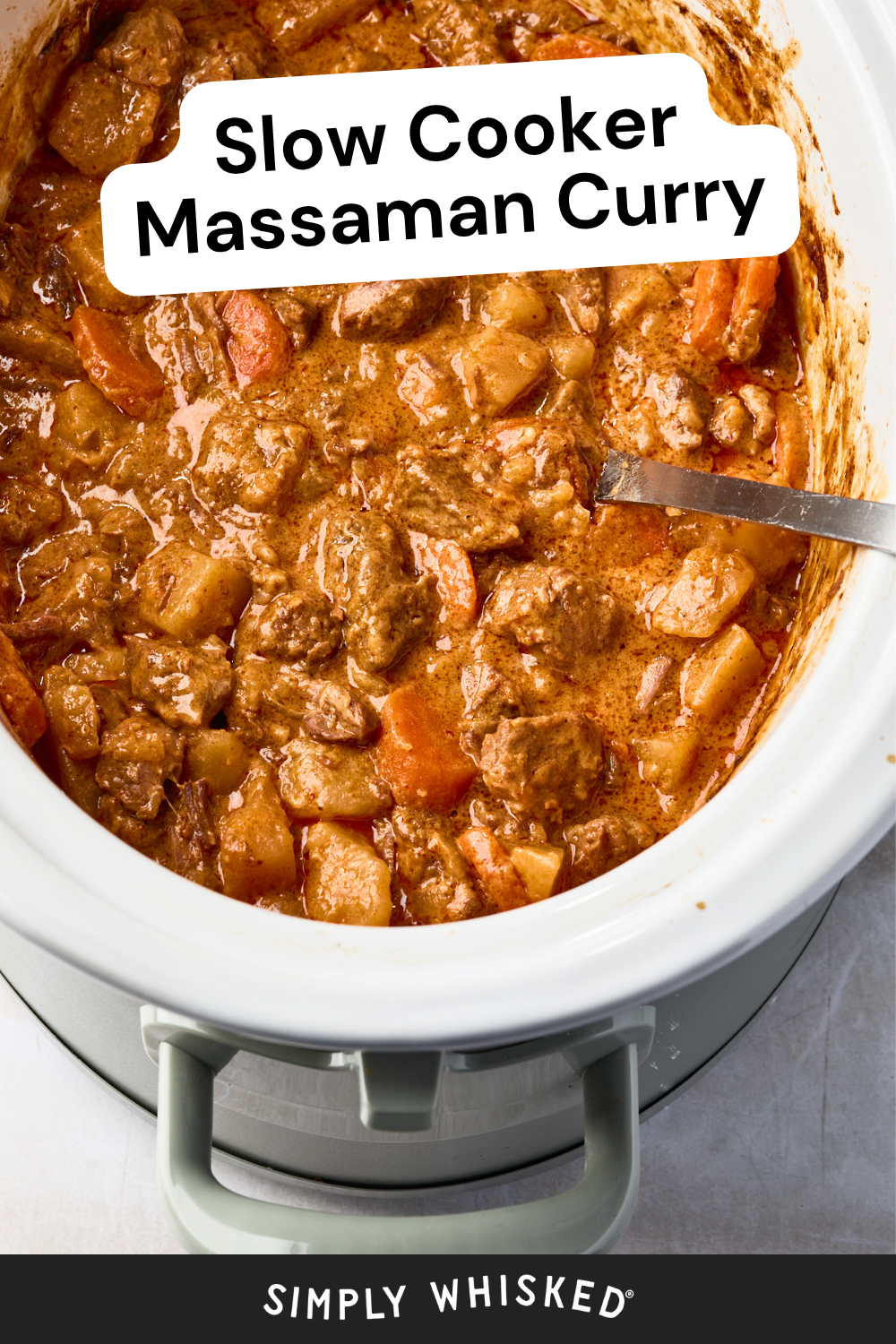 A slow cooker filled with massaman beef curry, showing chunks of meat, potatoes, and carrots in a rich brown sauce, with a serving spoon inside. Text reads: Slow Cooker Massaman Curry, Simply Whisked.