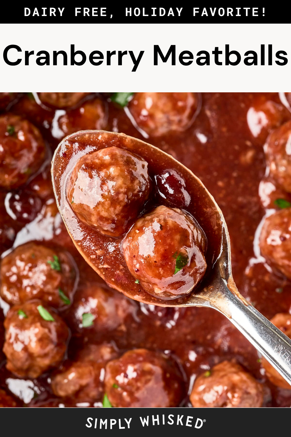 A close-up of a spoonful of cranberry meatballs covered in sauce, surrounded by more meatballs in a rich red sauce. The text reads Cranberry Meatballs, dairy free, holiday favorite!.