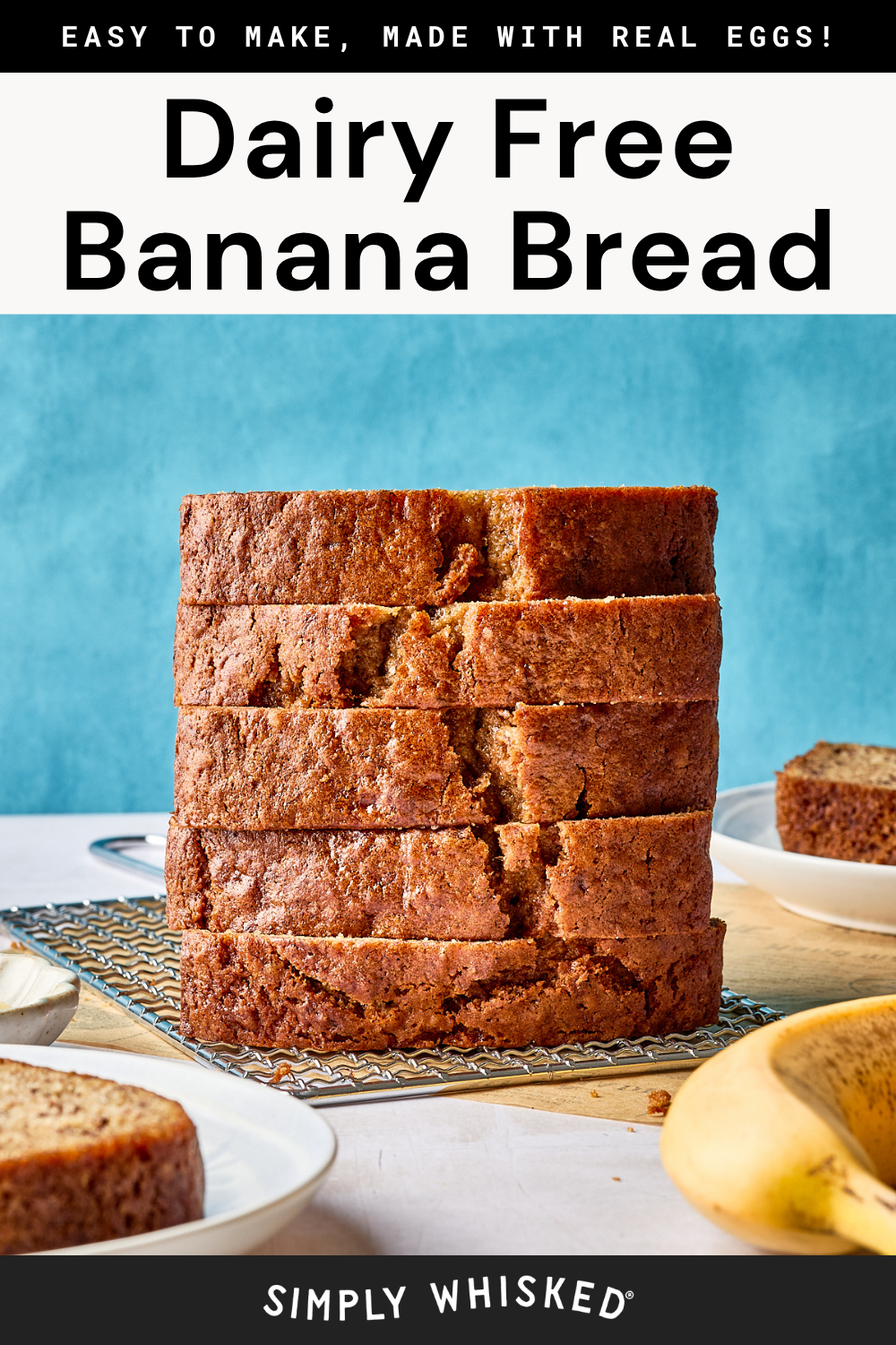 A stack of six thick slices of banana bread sits on a wire rack, with slices on plates nearby and a banana in the foreground. Bold text reads Dairy Free Banana Bread.