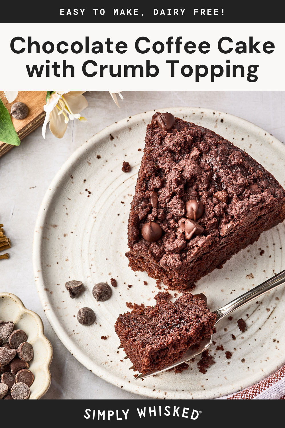 A slice of chocolate coffee cake with crumb topping and chocolate chips sits on a plate with a fork. Chocolate chips are scattered nearby. Text reads: Chocolate Coffee Cake with Crumb Topping. Easy to make, dairy free!.